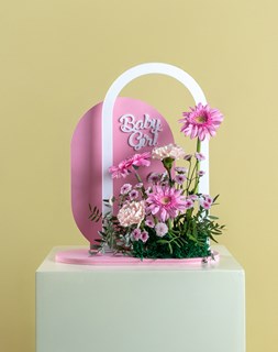 Show details for Baby Girl Pink Gerbera Arch Stand  Picture of Baby Girl Pink Gerbera Arch Stand